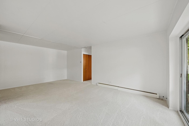 801 E Miner St Unit 1A, Arlington Heights, IL 60004 - unfurnished room featuring a baseboard radiator and light carpet