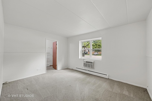 801 E Miner St Unit 1A, Arlington Heights, IL 60004 - empty room featuring a baseboard heating unit, carpet, and baseboards