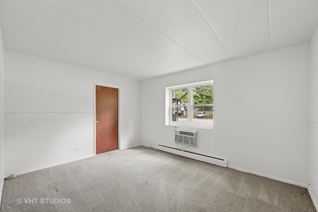 801 E Miner St Unit 1A, Arlington Heights, IL 60004 - unfurnished room featuring baseboard heating, carpet flooring, a wall mounted AC, and baseboards