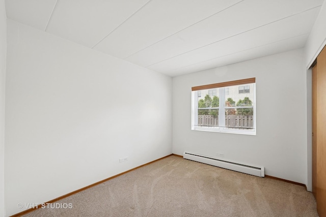801 E Miner St Unit 1A, Arlington Heights, IL 60004 - unfurnished bedroom with a baseboard radiator, carpet floors, and baseboards