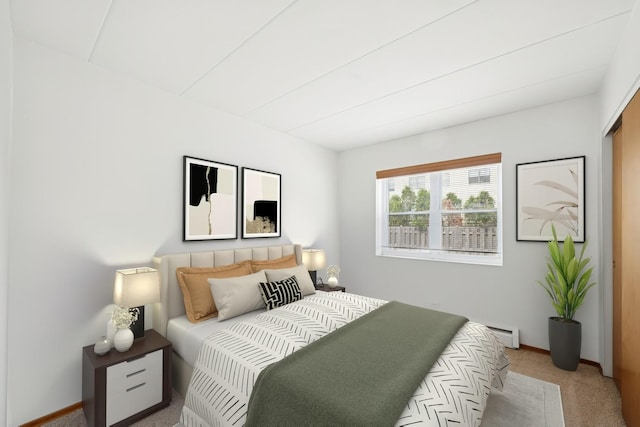 801 E Miner St Unit 1A, Arlington Heights, IL 60004 - carpeted bedroom featuring a baseboard heating unit and baseboards