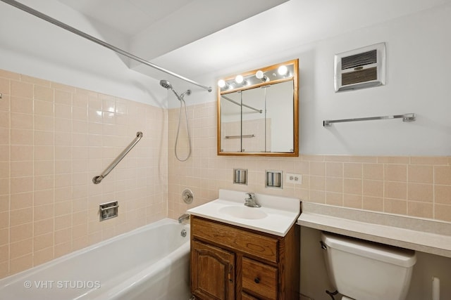 801 E Miner St Unit 1A, Arlington Heights, IL 60004 - bathroom with a wall mounted AC, bathtub / shower combination, vanity, toilet, and tile walls