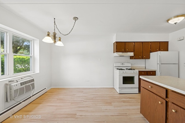 801 E Miner St Unit 1A, Arlington Heights, IL 60004 - kitchen featuring white appliances, under cabinet range hood, a baseboard radiator, light wood finished floors, and a chandelier