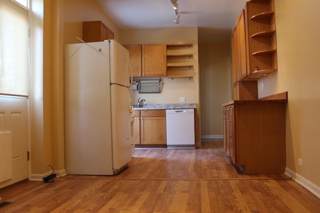 741 N Christiana Ave, Chicago, IL 60624 - kitchen featuring white appliances, open shelves, and wood finished floors