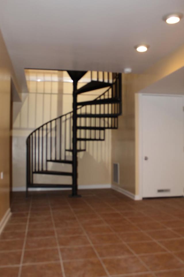 741 N Christiana Ave, Chicago, IL 60624 - stairway with baseboards, tile patterned floors, and recessed lighting