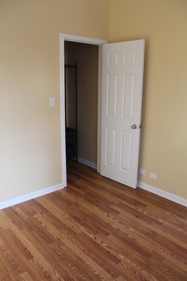 741 N Christiana Ave, Chicago, IL 60624 - empty room with wood finished floors and baseboards