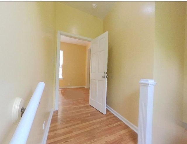 741 N Christiana Ave, Chicago, IL 60624 - hallway featuring an upstairs landing and light wood-style floors