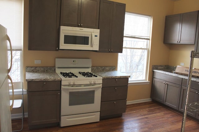 741 N Christiana Ave, Chicago, IL 60624 - kitchen with white appliances, dark wood-style floors, baseboards, and dark brown cabinets
