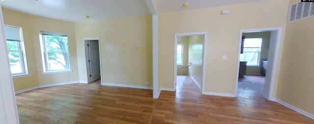 741 N Christiana Ave, Chicago, IL 60624 - unfurnished living room featuring wood finished floors