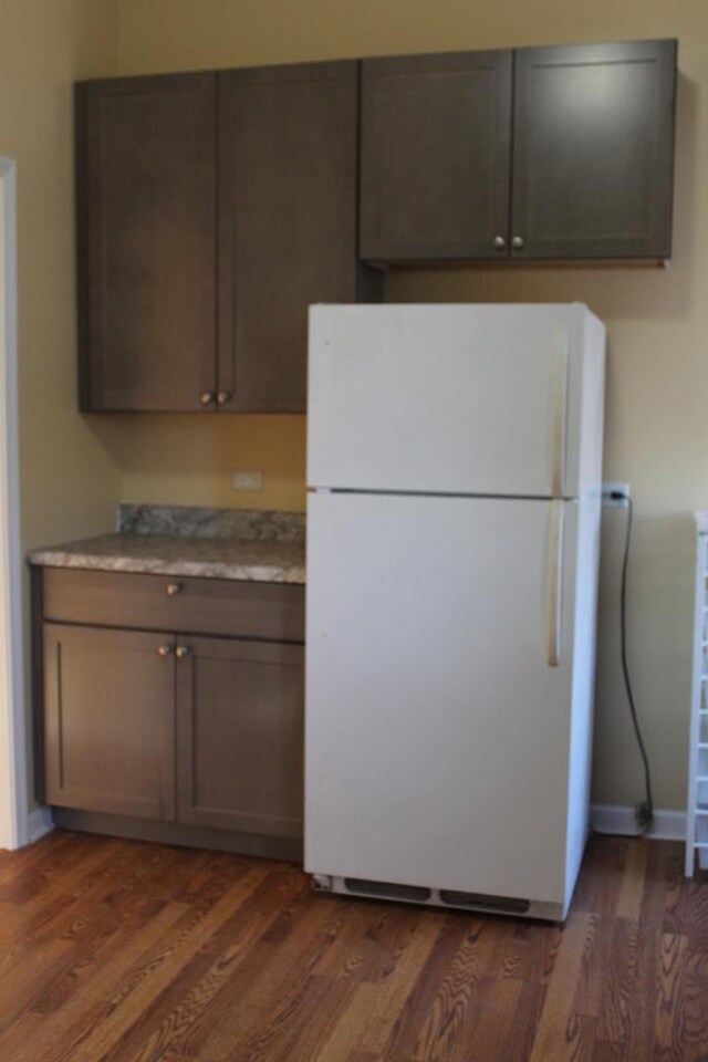 741 N Christiana Ave, Chicago, IL 60624 - kitchen featuring freestanding refrigerator, dark wood-type flooring, and light countertops