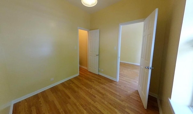 741 N Christiana Ave, Chicago, IL 60624 - spare room with wood finished floors and baseboards