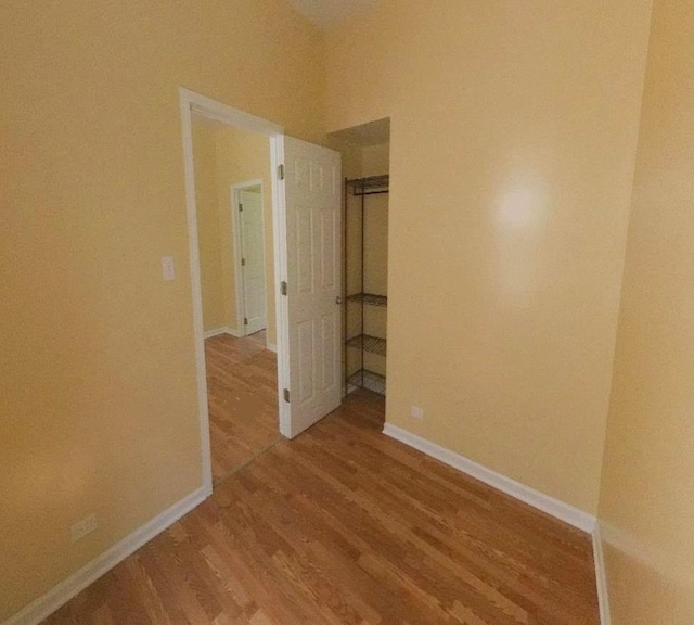 741 N Christiana Ave, Chicago, IL 60624 - spare room with wood finished floors and baseboards