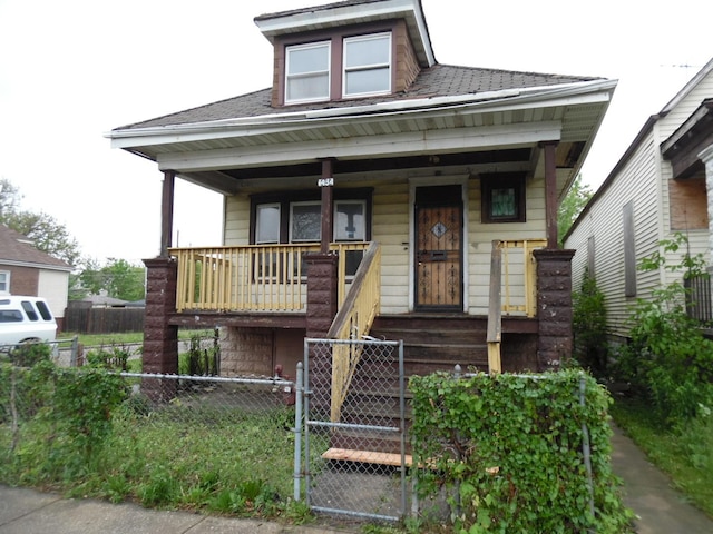 1434 W 72nd Pl, Chicago, IL 60636 - view of front of home with a porch and a shingled roof