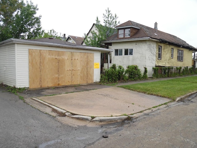 1434 W 72nd Pl, Chicago, IL 60636 - view of front of property featuring a garage, a front lawn, and a chimney