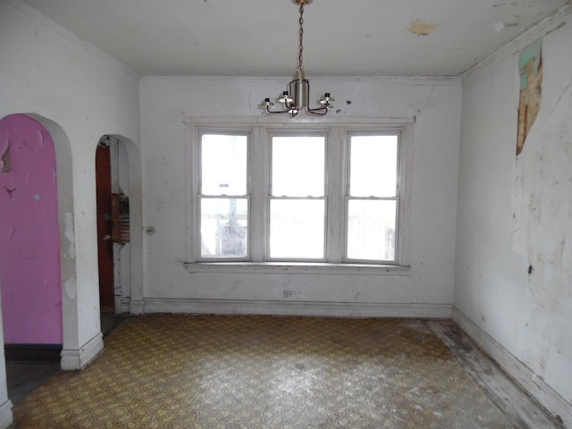 1434 W 72nd Pl, Chicago, IL 60636 - unfurnished dining area with a chandelier, crown molding, and arched walkways