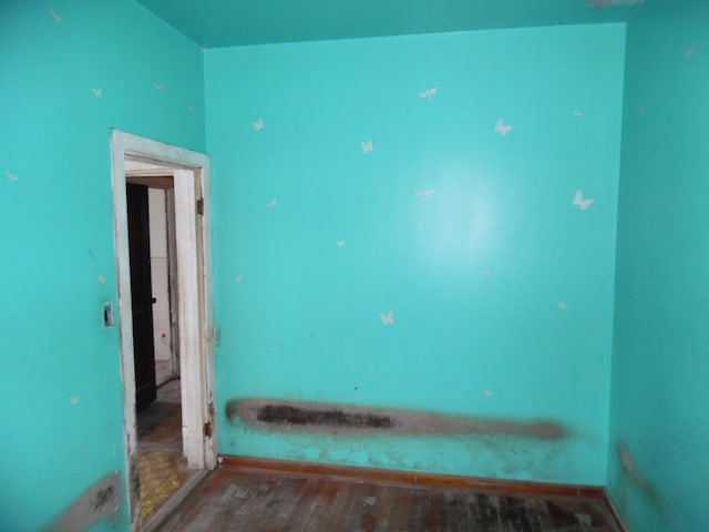 1434 W 72nd Pl, Chicago, IL 60636 - empty room featuring wood finished floors and baseboards