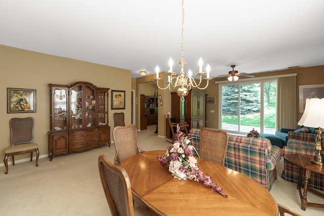 13391 Crestview Dr, Huntley, IL 60142 - dining space with ceiling fan, light colored carpet, and a chandelier
