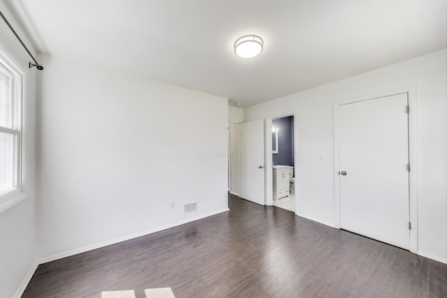 3505 Newcastle Rd, Waukegan, IL 60087 - unfurnished bedroom with dark wood-type flooring, baseboards, and ensuite bath