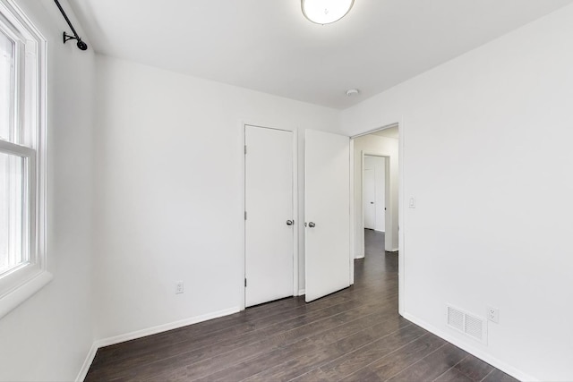 3505 Newcastle Rd, Waukegan, IL 60087 - unfurnished bedroom featuring dark wood finished floors and baseboards
