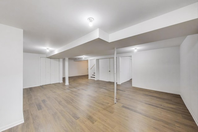 3505 Newcastle Rd, Waukegan, IL 60087 - finished below grade area with wood finished floors, baseboards, and stairs