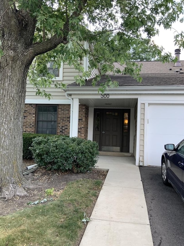 300 Pembridge Ln Unit D2, Schaumburg, IL 60193 - entrance to property with brick siding and roof with shingles