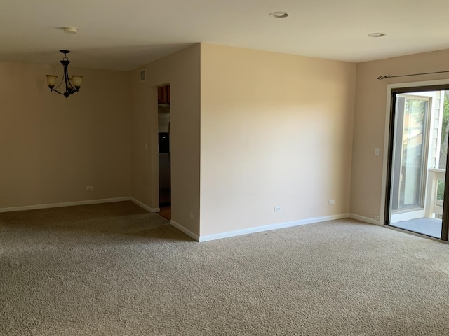 300 Pembridge Ln Unit D2, Schaumburg, IL 60193 - empty room featuring light carpet, a chandelier, recessed lighting, and a smoke detector