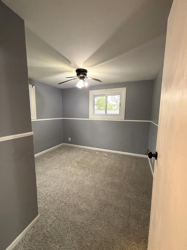 1403 Kings Rd, Carpentersville, IL 60110 - carpeted empty room featuring ceiling fan and baseboards