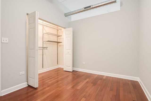 3125 W Fullerton Ave Unit 214, Chicago, IL 60647 - unfurnished bedroom featuring hardwood / wood-style flooring