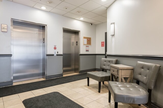 3125 W Fullerton Ave Unit 214, Chicago, IL 60647 - building lobby featuring a paneled ceiling, a security system, and recessed lighting