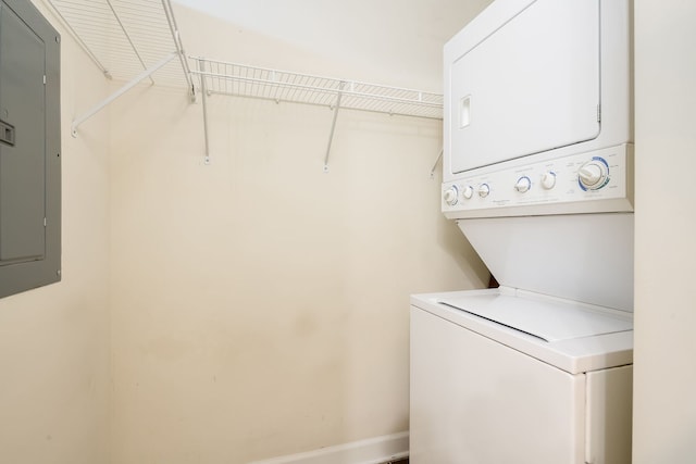 3125 W Fullerton Ave Unit 214, Chicago, IL 60647 - washroom featuring stacked washing machine and dryer and electric panel