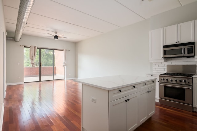 3125 W Fullerton Ave Unit 214, Chicago, IL 60647 - kitchen with stainless steel appliances, a ceiling fan, backsplash, and dark wood finished floors
