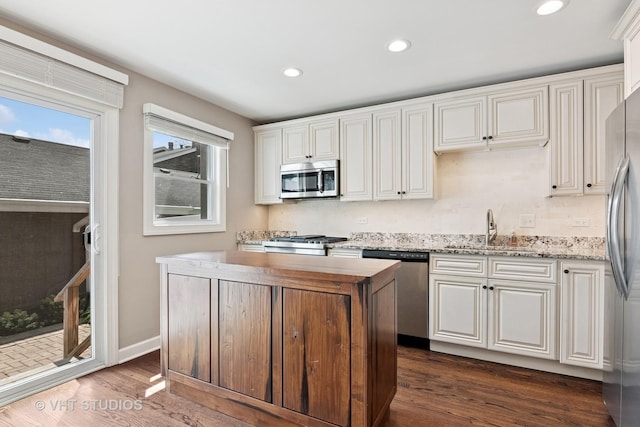 313 N Hale St, Wheaton, IL 60187 - kitchen with appliances with stainless steel finishes, butcher block countertops, dark wood finished floors, recessed lighting, and white cabinetry