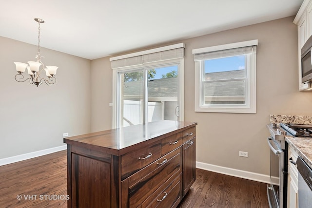 313 N Hale St, Wheaton, IL 60187 - kitchen with appliances with stainless steel finishes, dark wood-style floors, a chandelier, dark brown cabinetry, and pendant lighting