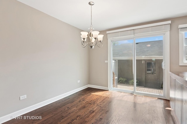 313 N Hale St, Wheaton, IL 60187 - unfurnished room featuring dark wood-style floors and a chandelier