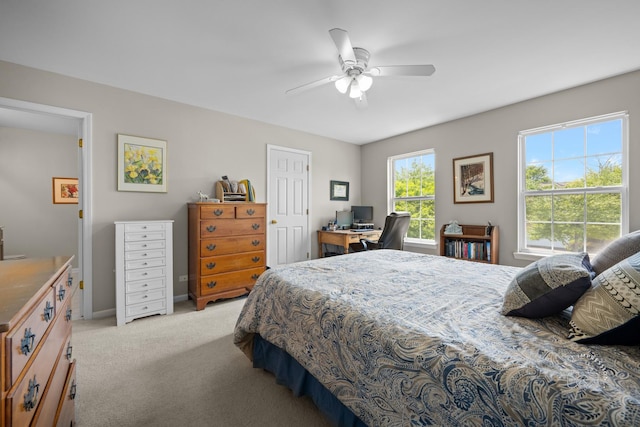2049 Sunrise Cir, Aurora, IL 60503 - bedroom with light colored carpet, a desk, and a ceiling fan