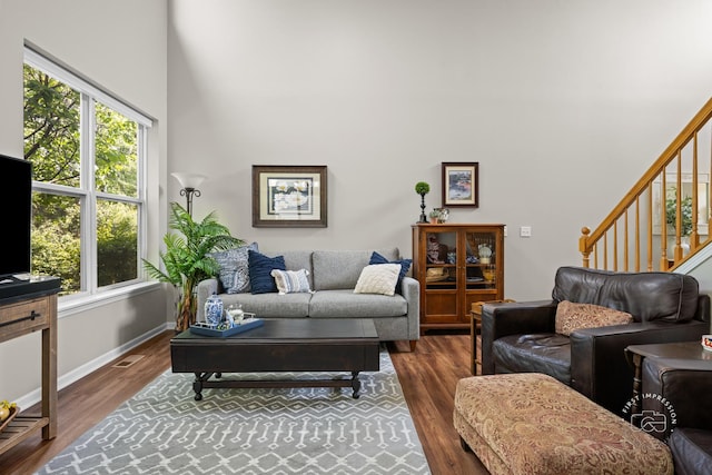 2049 Sunrise Cir, Aurora, IL 60503 - living area with a high ceiling, wood finished floors, plenty of natural light, and stairs