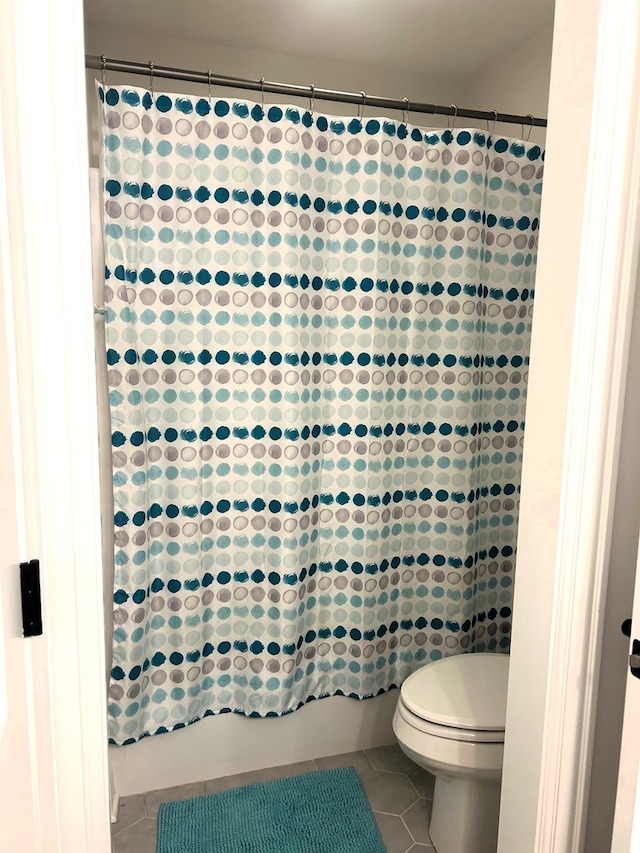 1405 Navajo Ct, Kankakee, IL 60901 - full bathroom with tile patterned floors, toilet, and shower / bath combination with curtain
