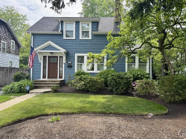 1314 Saint Johns Ave, Highland Park, IL 60035 - view of front of property featuring a shingled roof and a chimney