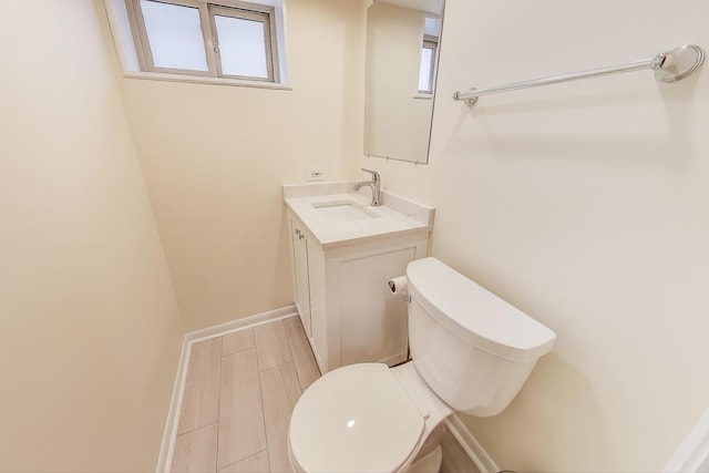 1314 Saint Johns Ave, Highland Park, IL 60035 - half bath with toilet, vanity, and baseboards