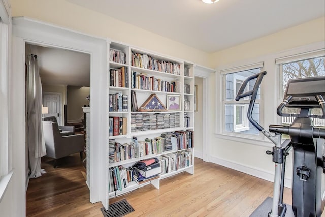 1314 Saint Johns Ave, Highland Park, IL 60035 - exercise room with wood finished floors, healthy amount of natural light, and baseboards