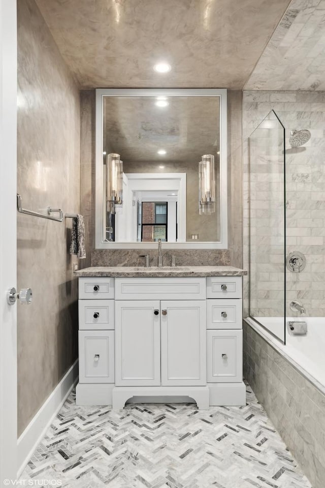 1155 N Dearborn St Unit 1301, Chicago, IL 60610 - bathroom featuring vanity, tiled shower / bath, baseboards, and recessed lighting