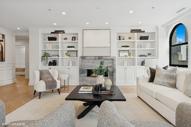 1155 N Dearborn St Unit 1301, Chicago, IL 60610 - living area with ornamental molding, recessed lighting, a high end fireplace, and built in shelves