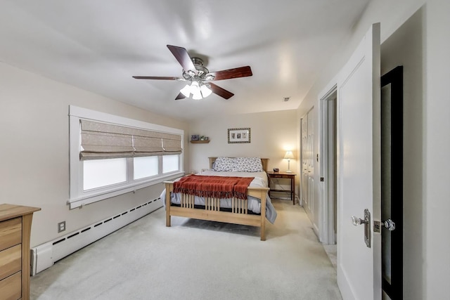 1350 Saint Johns Ave, Highland Park, IL 60035 - bedroom featuring a baseboard radiator, light colored carpet, and ceiling fan
