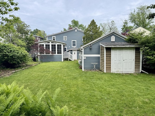 1350 Saint Johns Ave, Highland Park, IL 60035 - back of property featuring a sunroom, a lawn, an outbuilding, and a chimney
