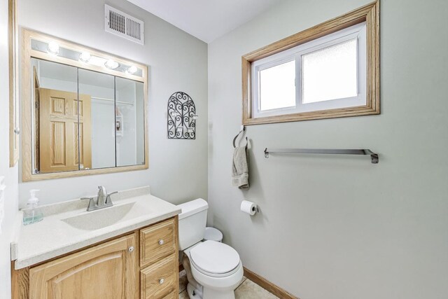 51 Julie Dr, Glenview, IL 60025 - bathroom featuring toilet, vanity, and baseboards