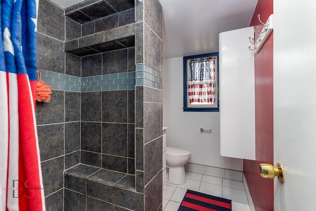 455 Sylvan Ave, Grand Ridge, IL 61325 - bathroom with tiled shower, toilet, and tile patterned flooring