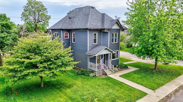 455 Sylvan Ave, Grand Ridge, IL 61325 - view of side of home featuring a lawn, a porch, and roof with shingles