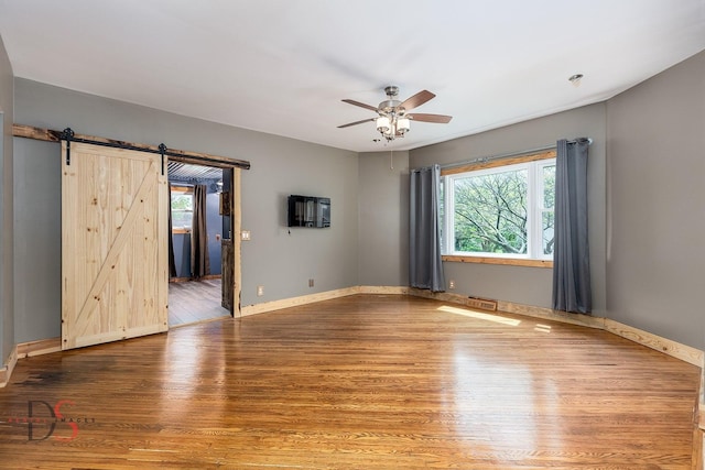 455 Sylvan Ave, Grand Ridge, IL 61325 - spare room with plenty of natural light, a ceiling fan, wood finished floors, and baseboards