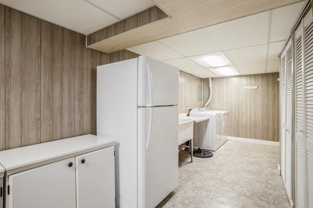 430 Florian Dr, Des Plaines, IL 60016 - laundry room with wood walls and washing machine and clothes dryer