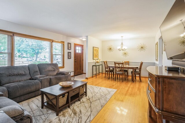 430 Florian Dr, Des Plaines, IL 60016 - living room featuring light wood finished floors and a chandelier